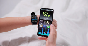 person checking the smart watch data on their phone app